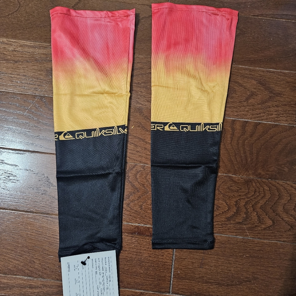 Quiksilver yellow and red protective arm sleeves